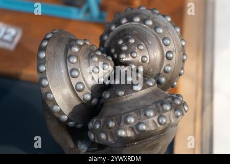 Drill bits. Perforator button for water wells. Tricone bit. Equipment for water and coal wells. Drilling hole equipment Stock Photo