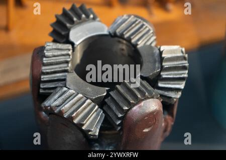 Drill bits. Perforator button for water wells. Tricone bit. Equipment for water and coal wells. Drilling cutter Stock Photo