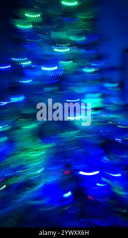 Chaotic lights in motion blur out of focus, colorful abstract background Stock Photo
