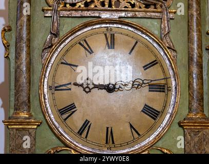 Old wall clock with roman numerals Stock Photo