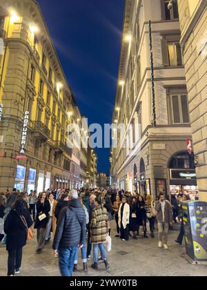 Pedestrians on the Via del Calzaiuoli at night in historic Florence, Italy. Stock Photo