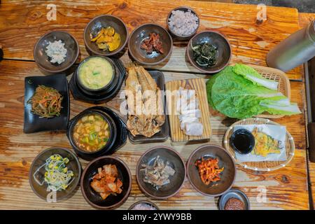 Traditional Jeju Island feast, fish, black pork, and banchan side dishes,  Seogwipo, Jeju, South Korea Stock Photo