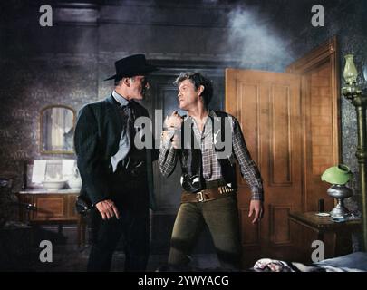 Kirk Douglas, Earl Holliman, on-set of the western film, 'Last Train From Gun Hill', Paramount Pictures, 1959 Stock Photo