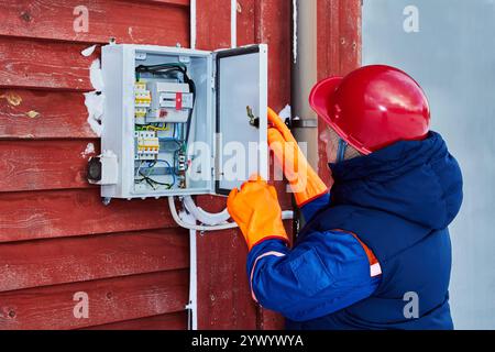 Energy company expert faulty circuit breaker testing. Stock Photo