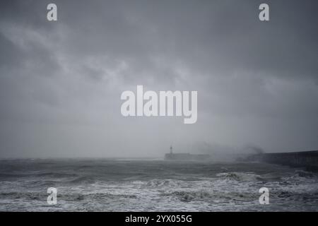 newhaven harbour arm sea wall on a stormy day Stock Photo