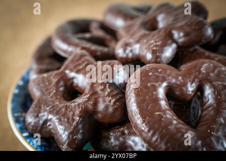 Gingerbread. Typical Christmas cookies on a plate isolated with text space on a brown background Stock Photo