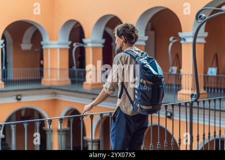 Male tourist in the Biblioteca Palafoxiana, Palafoxiana Library, Puebla, Mexico. Cultural exploration, history, and travel experience concept Stock Photo