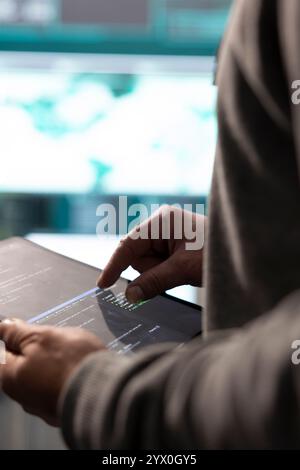 Cyber security expert working on encryption and IT security in a governmental agency. Man engaging on cyber operations, network security and data protection for hybrid war. Close up. Stock Photo