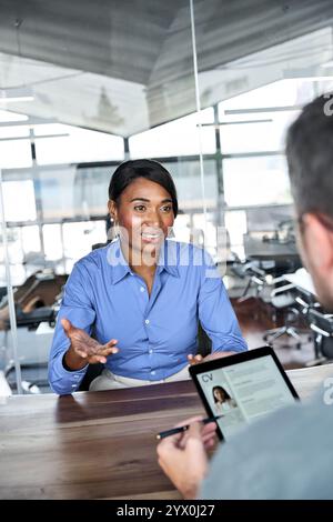 African American woman job seeker talking to professional male HR at interview. Stock Photo