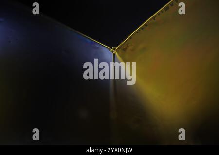 Green liquid edge on the dark background, colourful abstract, green shapes, minimalism, line of light, black and green Stock Photo