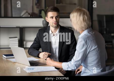 Two businesspeople discussing business-related issues in office Stock Photo