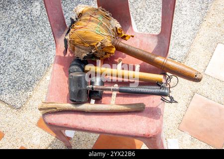 BANGKOK, THAILAND, OCT 06 2024, A group of mallets for striking gongs and bells in a Buddhist temple Stock Photo