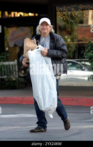 Eagles guitarist Joe Walsh and wife Marjorie Bach spotted post-honeymoon, enjoying shopping and coffee in Beverly Glenn, California. Stock Photo