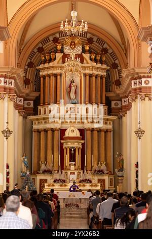 Jiquilpan, Michoacán, Mexico- December 24, 2023: A priest delivers a mass at a Catholic church. Stock Photo