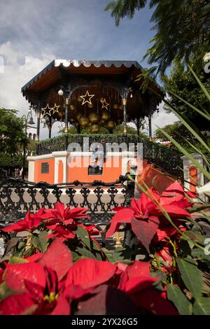 Jiquilpan, Michoacán, Mexico- December 24, 2023: Christmas ornaments hang on the historic central kiosk. Stock Photo