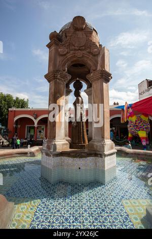 Jiquilpan, Michoacán, Mexico- December 24, 2023: Water bubbles out of the historic Aquadora Fountain in the central district. Stock Photo