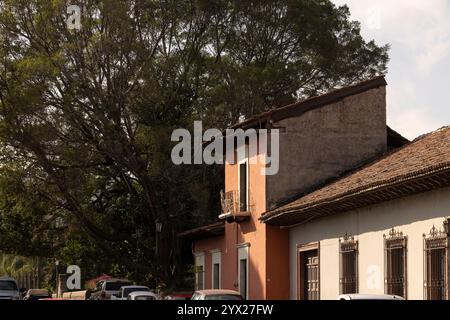 Jiquilpan, Michoacán, Mexico- December 24, 2023: Afternoon light shines on the colonial streets and buildings of central Jiquilpan. Stock Photo