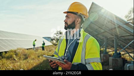 Solar panel, thinking and man with tablet, inspector and network with problem solving. Quality control, environment or employees in field, tech and Stock Photo