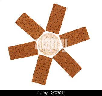 Composition of corn cracker and bread crisps. White background. Stock Photo