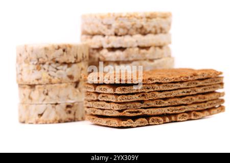 Composition of corn cracker and bread crisps. White background. Stock Photo