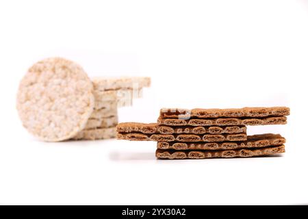 Composition of corn cracker and bread crisps. White background. Stock Photo