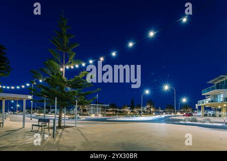 Adelaide, South Australia - February 28, 2021: Christies Beach Rotary Park illuminated at night while viewed across the Beach Road roundabout Stock Photo