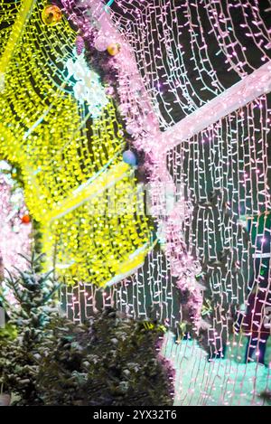 glowing colorful Christmas lights on black background, overlay Stock Photo