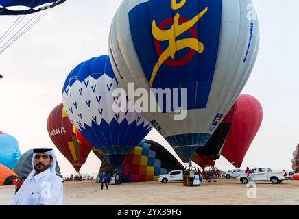 QATAR BALLOON FESTIVAL 2024 People look at hot air balloons to take off during the Qatar Balloon Festival 2024 in Doha,Qatar on December 13, 2024. The 5th Edition of Qatar Balloon Festival held here from Dec. 12 to 22, and more than 50 Participants are participating the Festival DOHA Qatar Copyright: xNOUSHADx Stock Photo