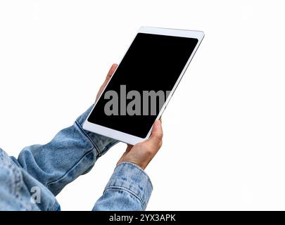 Isolated digital tablet with a blank screen in a female's hands wearing denim sleeves. Stock Photo