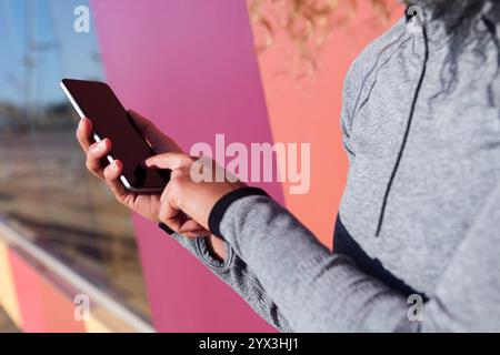 close up of an anonymous woman using cellphone Stock Photo
