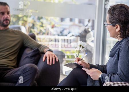Psychotherapy session, Therapist and client in conversation Stock Photo