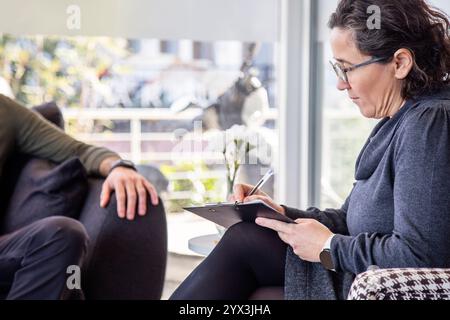 Psychotherapy session, Therapist and client in conversation Stock Photo