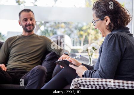 Psychotherapy session, Therapist and client in conversation Stock Photo