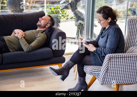 Psychotherapy session, Therapist and client in conversation Stock Photo