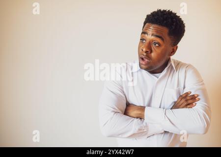 Portrait of young businessman who is shocked. Stock Photo