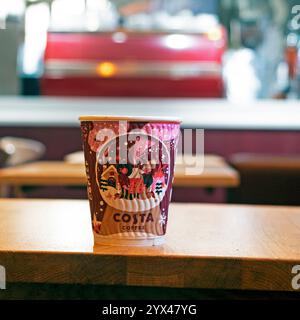 Costa coffee paper cup on table at Christmas Xmas inside Costa shop London UK Great Britain 2024   KATHY DEWITT Stock Photo