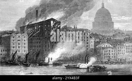 The Fire at the City Flour-Mills in Upper Thames-Street, [London, seen from the River Thames], 1872. This building [belonging to Messrs J. Hadley and Co.] stood a little below Blackfriars Bridge...Along the western side was the creek or dock, in which barges could be unloaded. An immense quantity of grain, said to amount to 200,000 quarters, was stored in these mills...It was in the third floor that the fire broke out. The alarm was given to the Metropolitan Fire Brigade, in Watling-street, where two engines, one a powerful steamer, were got out, and in less than five minutes were on the way t Stock Photo