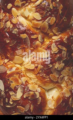 Braided, sweet bread pie, with sliced almonds, close-up, breakfast, braided bread, brioche, top view, no people Stock Photo