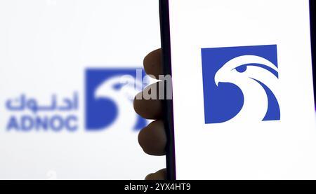 Abu Dhabi National Oil Company (ADNOC) on smartphone. Stock Photo