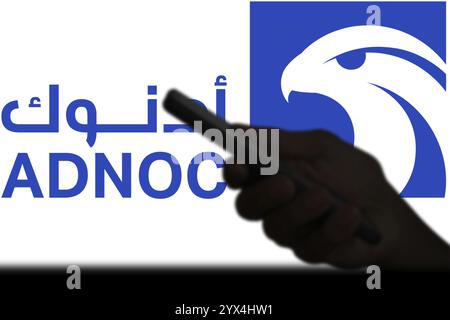 Abu Dhabi National Oil Company (ADNOC) on smartphone. Stock Photo