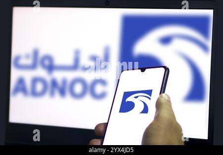 Abu Dhabi National Oil Company (ADNOC) on smartphone. Stock Photo