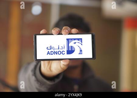 Abu Dhabi National Oil Company (ADNOC) on smartphone. Stock Photo