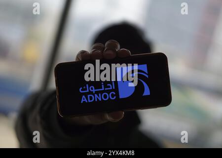 Abu Dhabi National Oil Company (ADNOC) on smartphone. Stock Photo