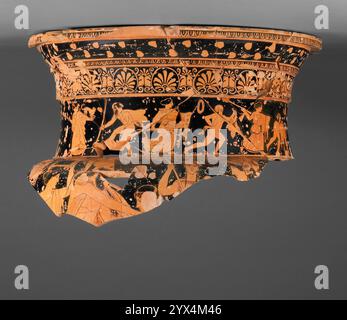 Attic Red-Figure Volute Krater, about 445-430 BC.  Additional Info: Fragments preserving most of the rim and neck, as well as a small section of the upper body. Neck. A.B. A thiasos with six satyrs and five maenads runs around the neck interrupted by the handles.Flaring rim flat and black on the top. Offset at the top of figured frieze and another at the top of the lotus and palmette frieze; a groove at the junction of the neck with the body. Interior black to the base of the neck with a reserved band under the shoulder and thinner, irregular black inside the body. Ionic kymation on the outsid Stock Photo