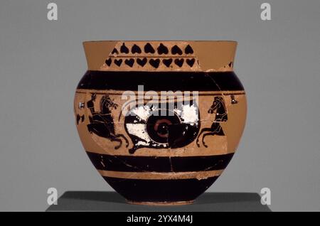 Attic Black-Figure Mastoid Cup, about 490 BC.  Additional Info: Eyes; three men on horseback around. Unidentified figure on the reverse (crouching human, tree branches?) Ivy leaves on the rim. Stock Photo