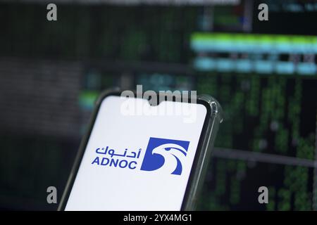 Abu Dhabi National Oil Company (ADNOC) on smartphone. Stock Photo