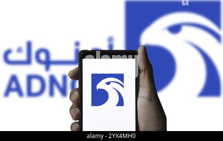 Abu Dhabi National Oil Company (ADNOC) on smartphone. Stock Photo