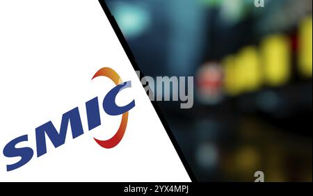SMIC logo is displayed on smartphone. Semiconductor Manufacturing ...