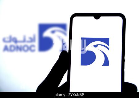 Abu Dhabi National Oil Company (ADNOC) on smartphone. Stock Photo