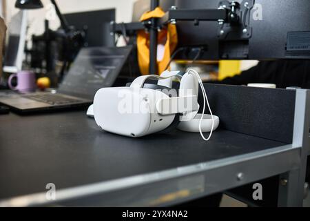 VR headset resting on a contemporary workspace table highlights cutting-edge technology and immersive experience concept Stock Photo